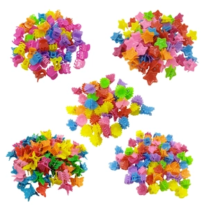 Detailed view of colorful mini hair clips in star, flower, and butterfly shapes