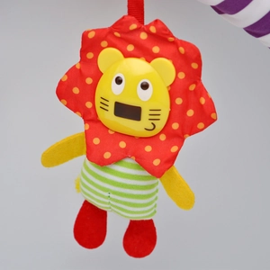 Detail of colorful hanging lion stroller toy with textured fabrics and soft rattle
