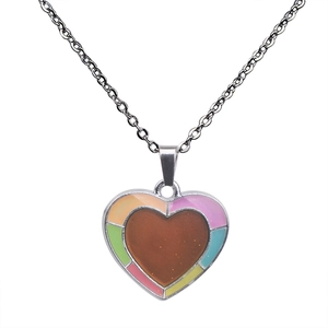 Detail of color-changing heart pendant necklace with multi-color enamel and silver chain