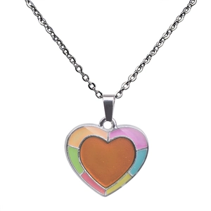 Detail of color-changing heart pendant with vibrant enamel edges on a silver chain