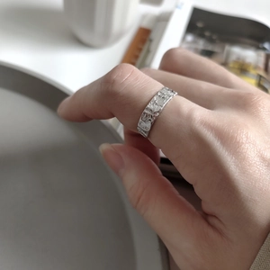 S925 sterling silver irregular textured wide ring worn on finger in minimalist style