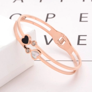 Rose gold heart bangle with black and white shell inlays and sparkling rhinestones