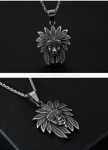 Detail of vintage steel Indian chief pendant showing intricate feather and facial textures