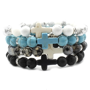 Detail view of 4-piece bead bracelet set with cross pendants and natural stone textures