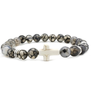 Cross charm bracelet with black and white agate stone beads on a clean white background