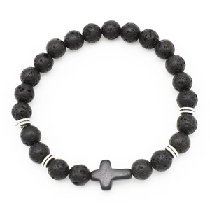 Close-up of black volcanic lava stone bracelet with silver spacers and cross pendant