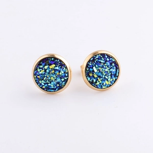 Detail of 10mm round gold-plated stud earrings with sparkling blue and green crystal texture