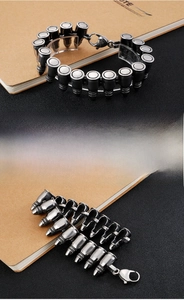 Close-up of punk rock bullet-shaped links on a black and silver metallic bracelet