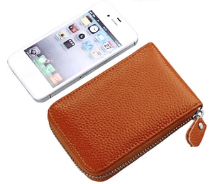 Detail of brown litchi pattern leather card wallet with secure perimeter zipper closure
