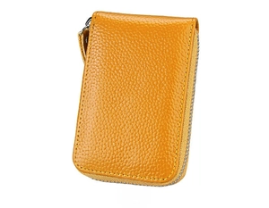 Detail view of the yellow lychee grain leather wallet showing back texture and zipper