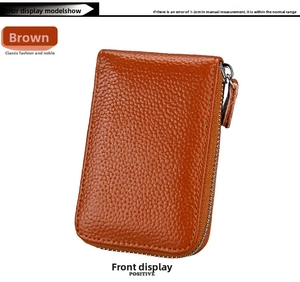 Close-up of brown genuine leather card holder with litchi texture and metal zipper detail