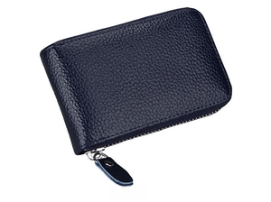 Side view of dark blue leather card holder with litchi texture and metal zipper