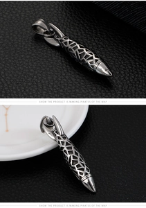 Close-up of vintage stainless steel rocket pendant with detailed hollow mesh texture
