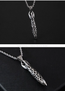 Detailed views of a retro rocket pendant with hollow geometric patterns and rope chain