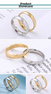 Detailed close-up of 4mm polished gold and silver stainless steel minimalist band rings