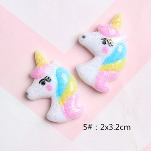 Close-up of 5# glitter resin unicorn head charms for DIY hair clips and shoe accessories
