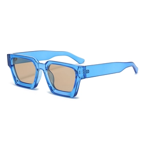 Detail of square blue transparent thick frames and tinted lenses on fashion sunglasses