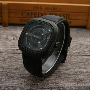 Close-up of black square quartz watch with unique turntable dial on a rustic wooden table