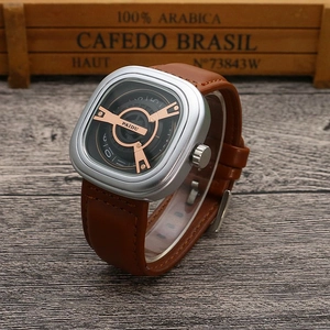 Detail of square quartz watch featuring a unique hollow dial and brown leather strap