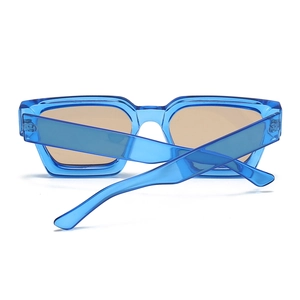 Detail of blue translucent rectangle sunglasses with thick frames and brown lenses