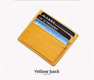 Slim yellow pebble leather card holder with three slots and contrast stitching back view
