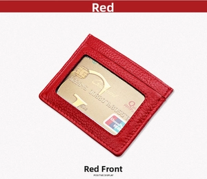 Detail of red leather RFID card holder with id window and fine stitching on grey background