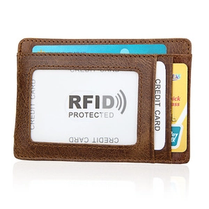 Close-up of brown leather card holder featuring RFID protection and multiple card slots