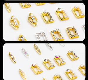 Detailed macro view of gold and silver alloy nail charms with pearls and rhinestones