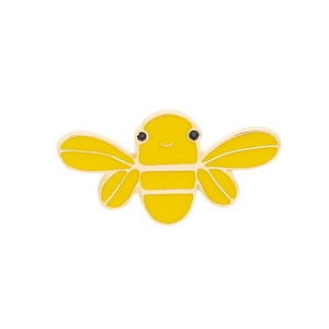 Detailed close-up of a creative cartoon honey bee enamel brooch with yellow finish