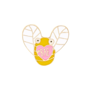 Detail of cartoon bee enamel brooch with yellow finish and pink BAE heart design