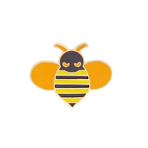 Close-up of yellow and black enamel bumblebee brooch with gold-toned metal finish details