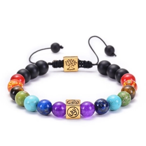 Close-up of Om and Tree of Life charms on multi-color 8mm lava rock yoga beads