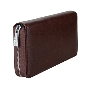 Detail of genuine leather grain texture and silver zipper on dark brown accordion wallet