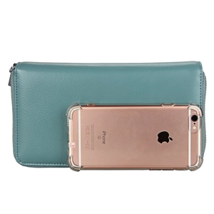 Blue leather RFID passport wallet shown with a phone for size comparison