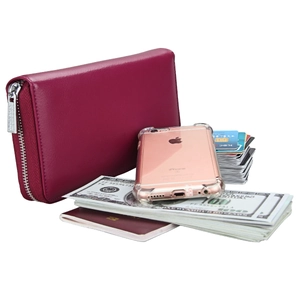 Detail of rose red leather passport wallet with litchi texture and silver zipper
