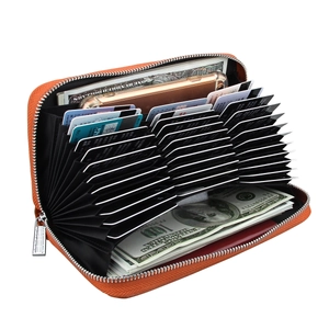 Detail view of orange leather accordion wallet with RFID slots and phone storage
