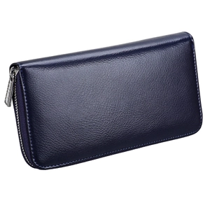 Detail of navy blue leather wallet featuring fine lychee texture and silver zipper pull