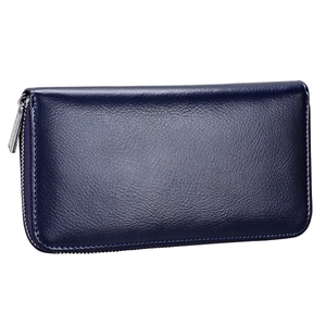 Macro shot of dark blue pebbled leather texture and silver zipper of the wallet