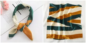 Macro detail of geometric satin square scarf featuring vintage wavy patterns and fine stitching