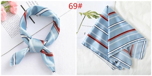 Blue satin neck scarf with red and white stripes shown worn and folded on white background