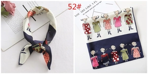 Close-up of silk-feel square scarf with cartoon girl print and navy contrast border