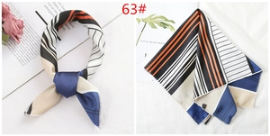 Detailed close-up of geometric pattern silk satin scarf with neat stitched edges