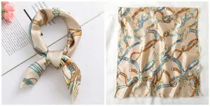 Detailed flat lay of equestrian print satin square scarf with belt and chain patterns