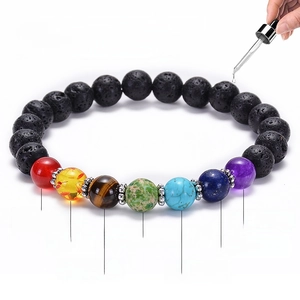 Lava stone chakra bracelet with seven natural gemstones shown as an essential oil diffuser