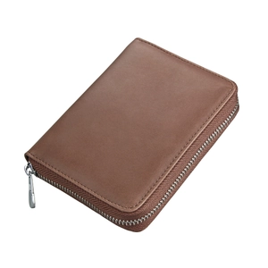 Detail of genuine brown leather wallet with silver metal zipper on white background