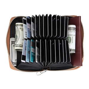 Detail view of brown leather accordion card holder with multi-slot RFID blocking pockets