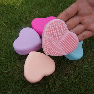 Detailed view of heart-shaped silicone makeup brush cleaners in five vibrant colors