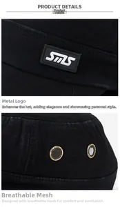 Detail of black cotton flat top cap showing SMS logo and metal mesh ventilation eyelets