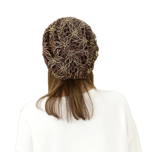 Women's brown lace beanie hat with gold thread floral embroidery seen from the back