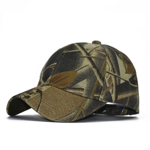 Detail view of the forest camouflage baseball cap featuring durable canvas and curved brim